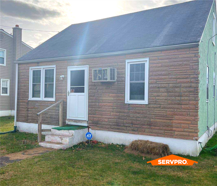 Ranch Home exterior damaged by flood