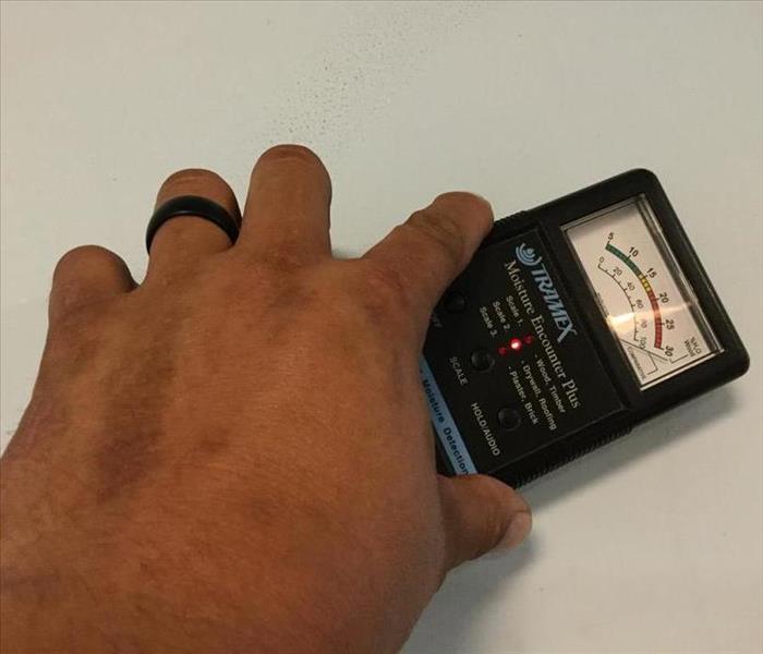 Moisture meter is used on a wall