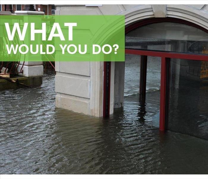 Flooded building. Sign that says WHAT WOULD YOU DO?